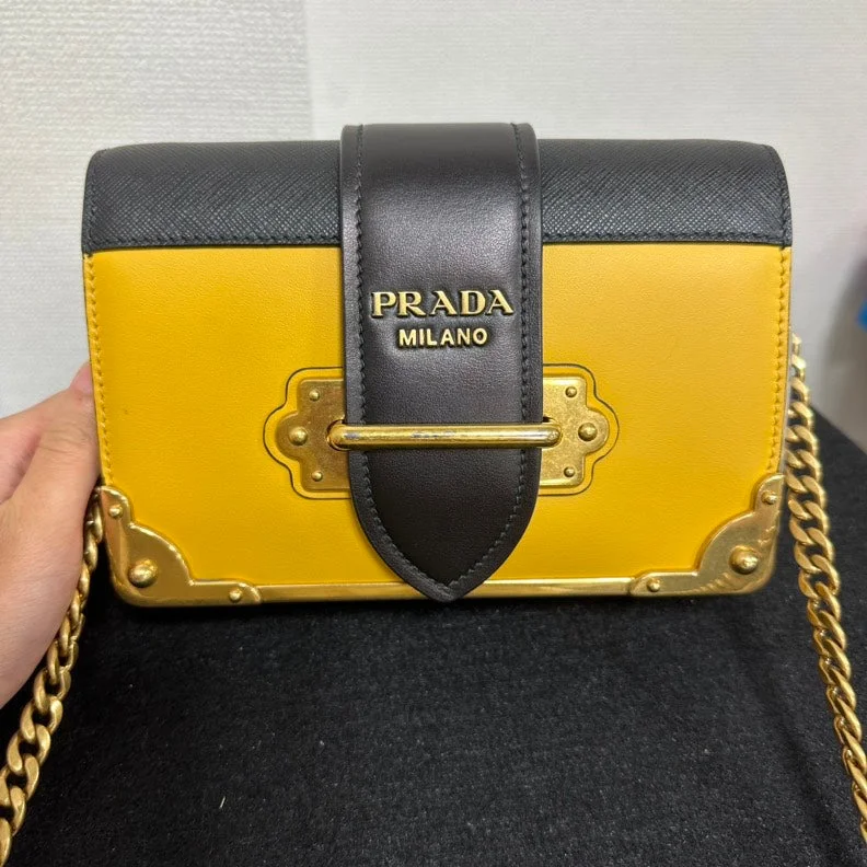 Prada Studded Leather Crossbody in Red for Rock - n - Roll StylePrada Cahier Crossbody Bag,Yellow & Black,Leather